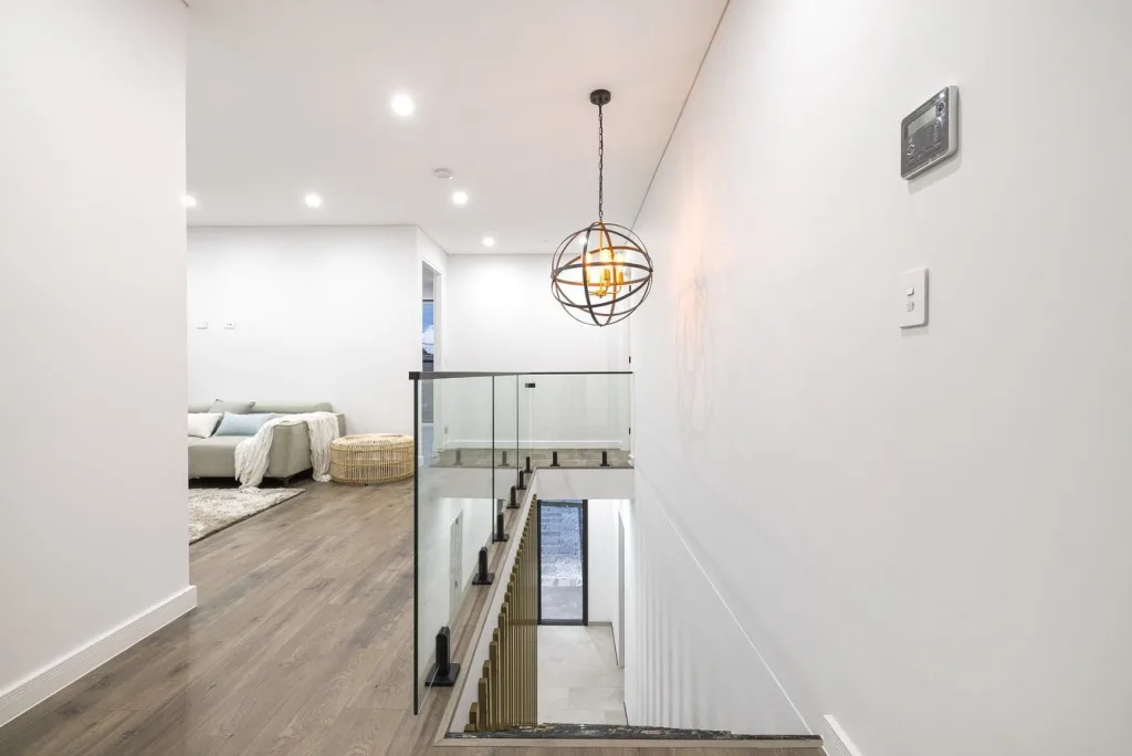Image shows a staircase in a modern home built by Sydney home builders Benelong Projects