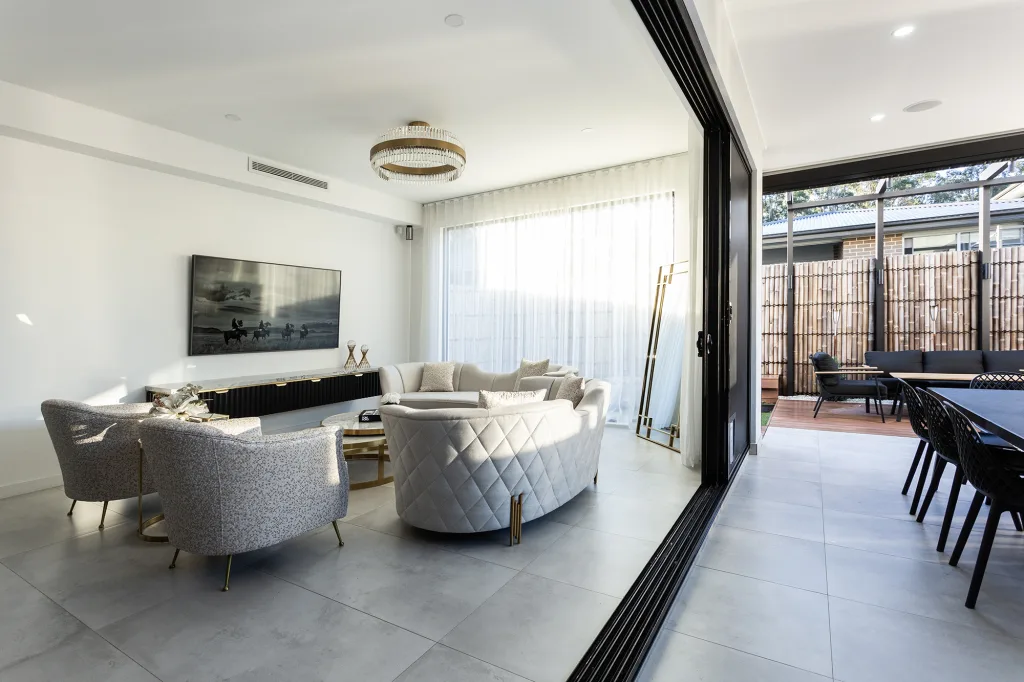 Image shows the transition from indoor living space to outdoor living and entertaining area